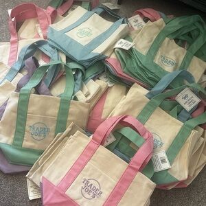 Trader Joe's Canvas Tote Bag - Pink, Green, Blue & Purple available. 12$ each.